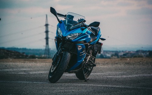 Image black and blue sports bike on road during daytime