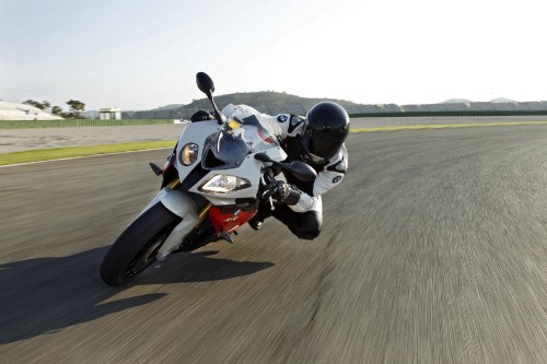 Image white and black sports bike on road during daytime