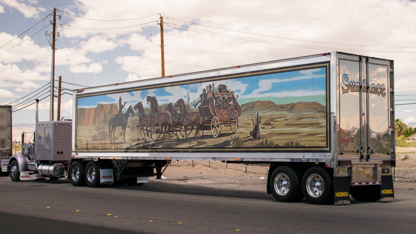 black and brown trailer truck on road during daytime