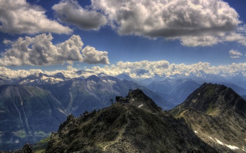 Image green mountain under white clouds and blue sky during daytime