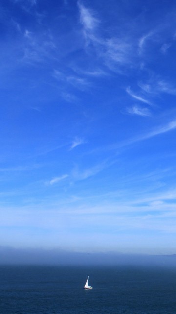Image person in black shirt standing on seashore during daytime