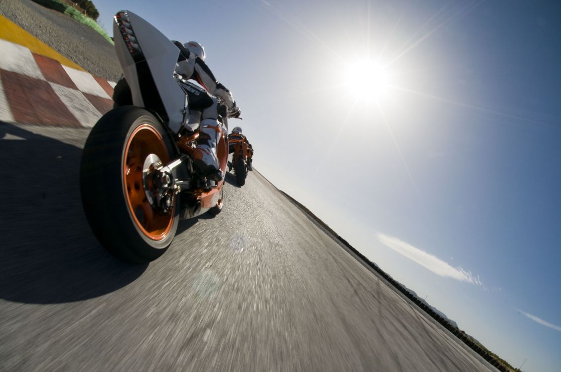 black motorcycle on gray road