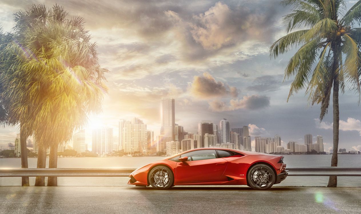 red porsche 911 on beach during sunset