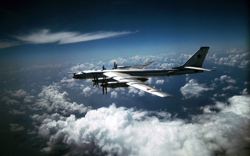 Image black and white jet plane flying under blue sky during daytime