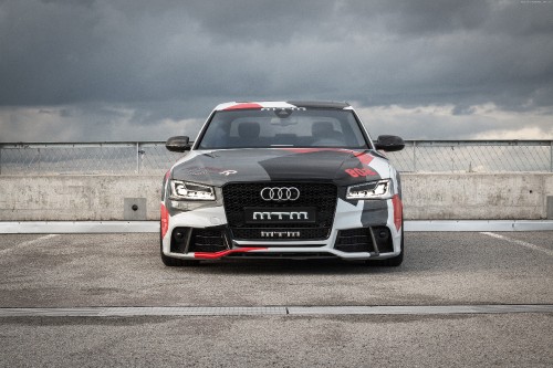 Image black audi a 4 on a gray asphalt road