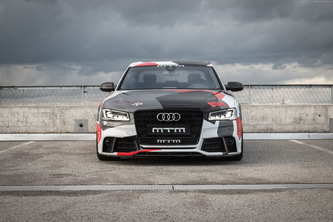 black audi a 4 on a gray asphalt road