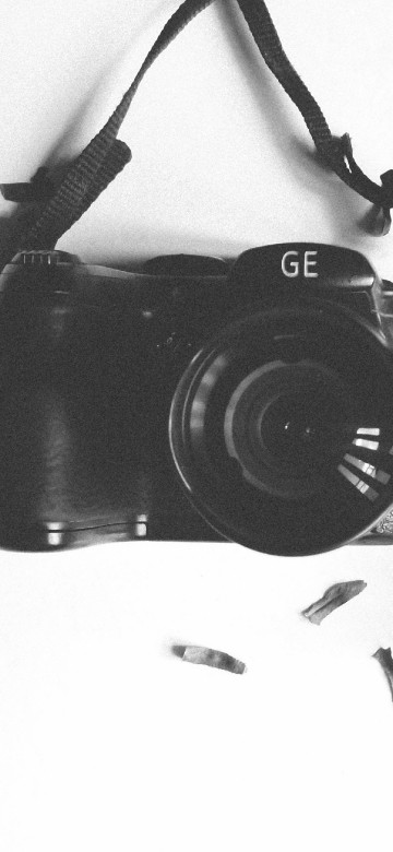 Image black nikon dslr camera on white textile