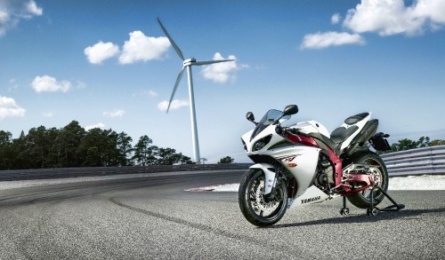 Image white and red sports bike on road during daytime