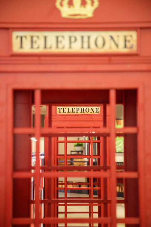 Image red wooden telephone booth with red wooden frame