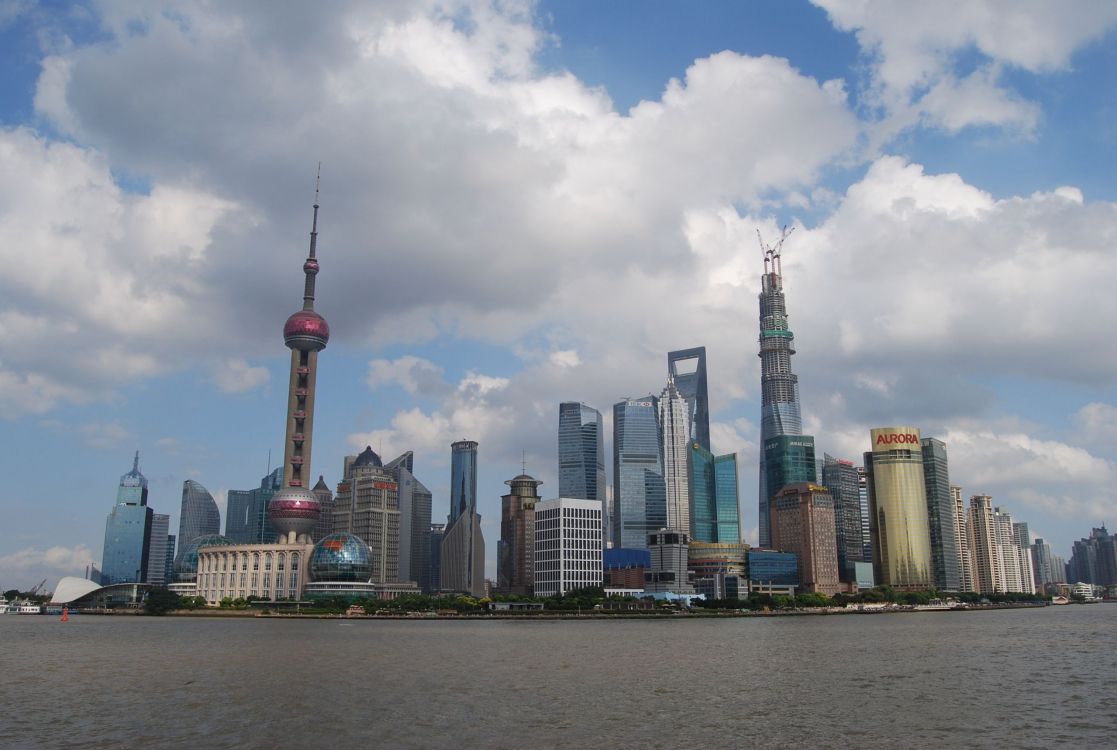 city skyline under cloudy sky during daytime