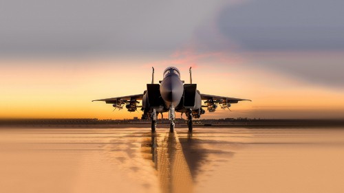 Image black jet plane on brown field during daytime