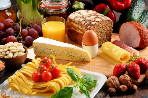 Image bread with cheese and tomatoes on white ceramic plate