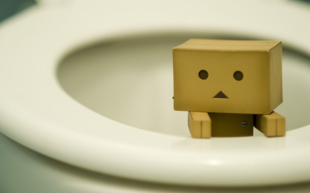 brown cardboard box on white ceramic sink