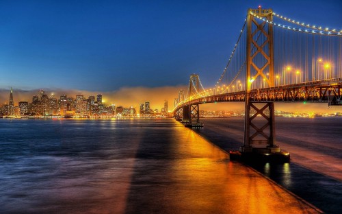 Image bridge over water during night time