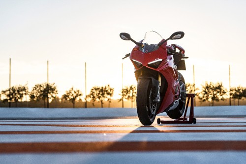 Image red and black sports bike on road during daytime