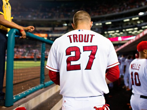 Image man in white and red baseball jersey shirt standing on stadium