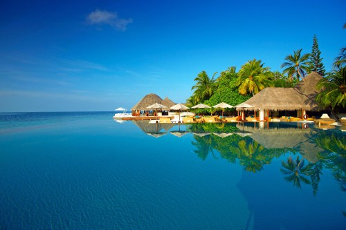 Image brown wooden house on body of water during daytime