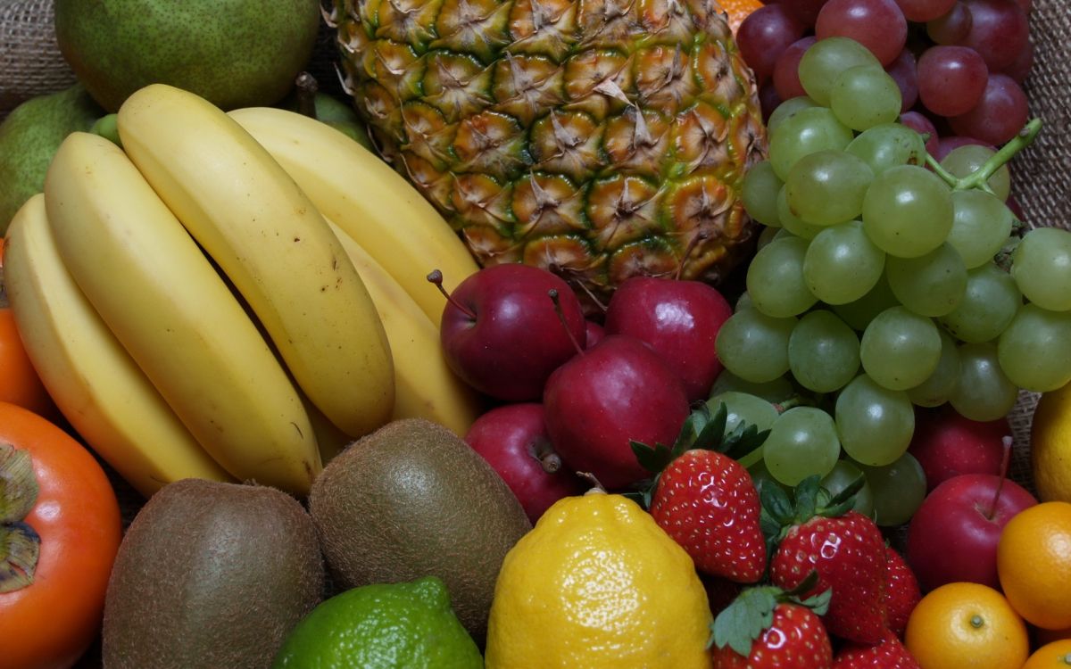 yellow banana fruit and red strawberries