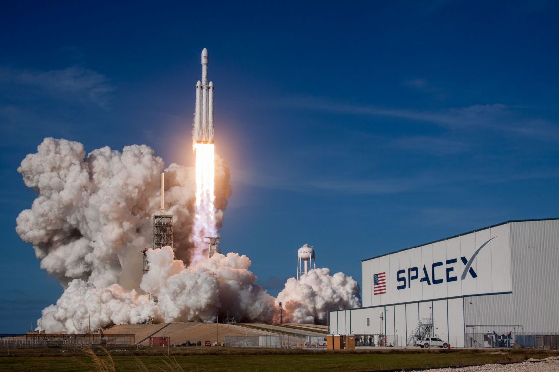 white space ship on sea under blue sky during daytime