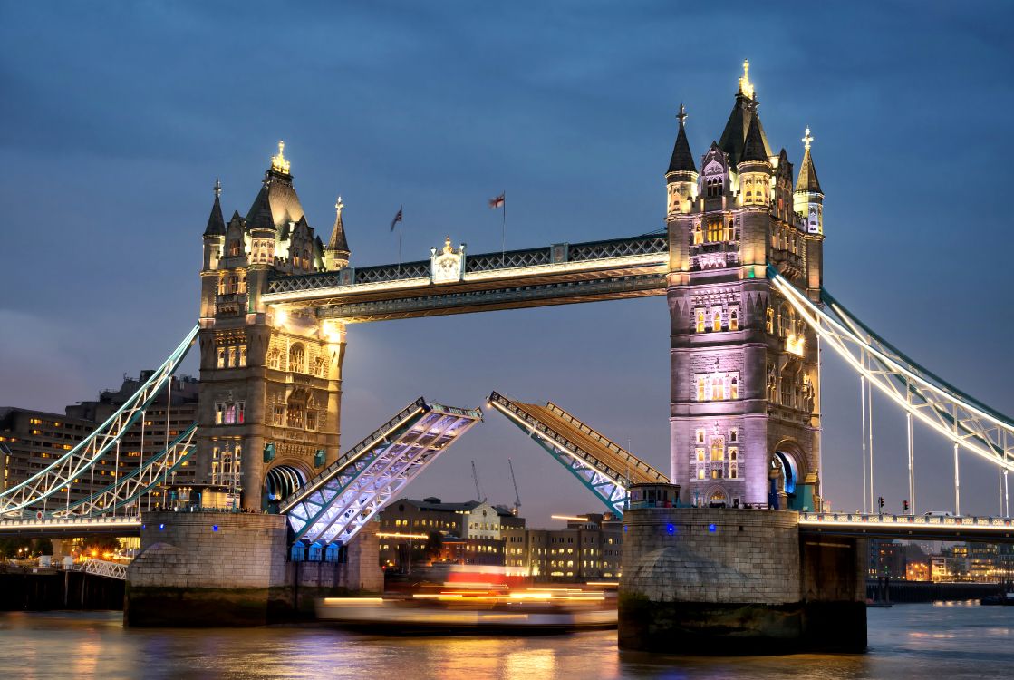 Brown Bridge Under Blue Sky During Night Time. Wallpaper in 4861x3256 Resolution