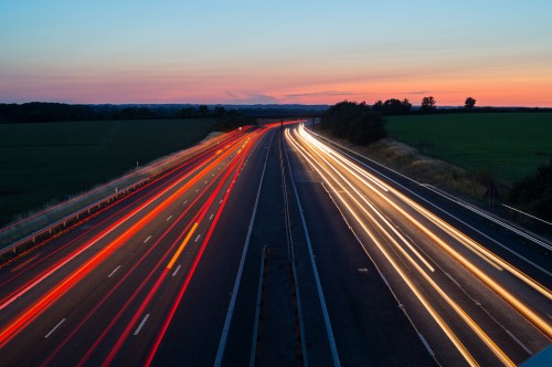 Image time lapse photography of cars on road during night time