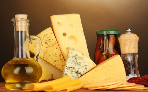 Image sliced cheese on yellow plastic tray