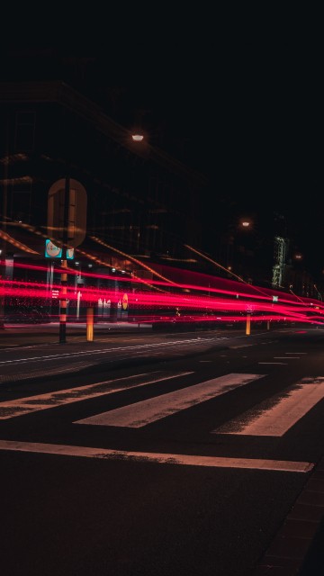 Image red and white light on road during night time