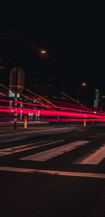 Image red and white light on road during night time