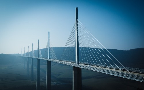 Image white bridge under blue sky during daytime