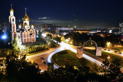 Image city with high rise buildings during night time