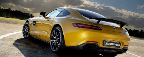 Image yellow porsche 911 on black asphalt road