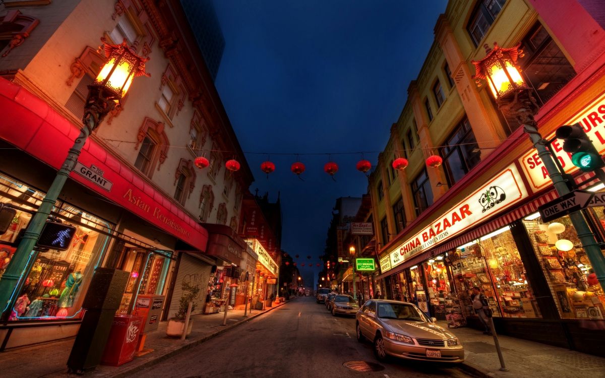 cars parked beside the road during night time