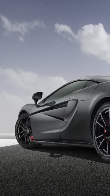 Image black porsche 911 on road under blue sky during daytime