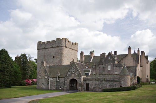 Image gray concrete castle under white clouds during daytime