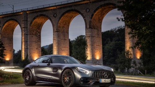 Image black mercedes benz coupe parked near brown concrete bridge during daytime