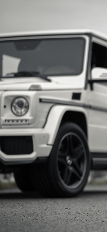 Image grayscale photo of suv on road