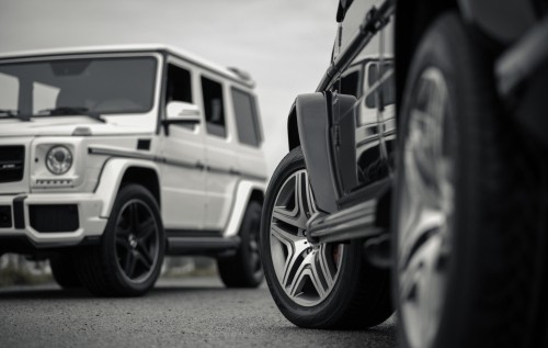 Image grayscale photo of suv on road