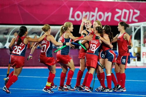 Image women in red and blue jersey shirts