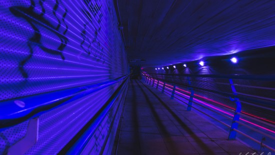 Image blue light on tunnel during night time