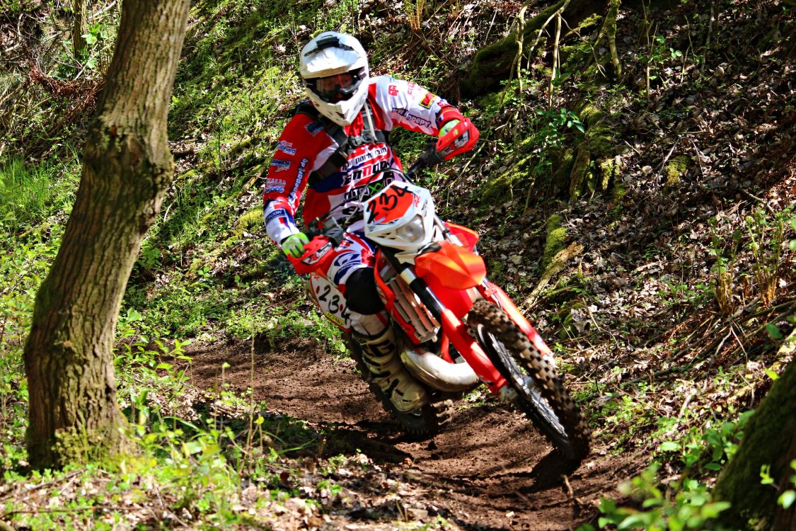 Man in Red and White Motocross Suit Riding Motocross Dirt Bike. Wallpaper in 5184x3456 Resolution
