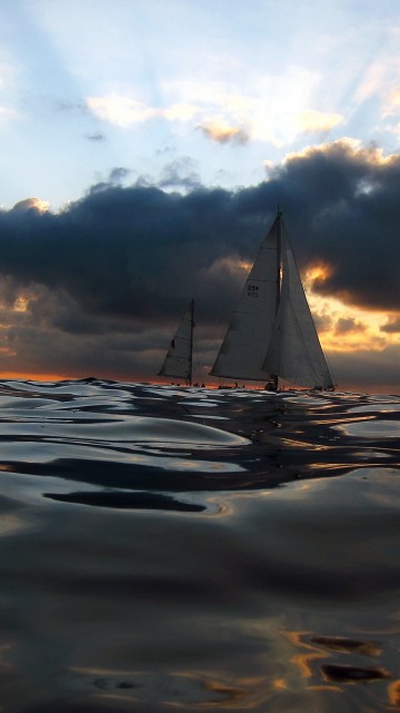 Image sailboat on sea under cloudy sky during daytime