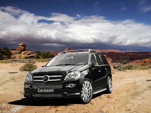 Image black mercedes benz g class suv on brown field under blue and white sunny cloudy sky