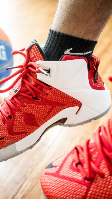Image person wearing red nike basketball shoes