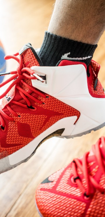 Image person wearing red nike basketball shoes