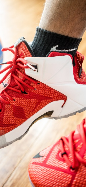 Image person wearing red nike basketball shoes