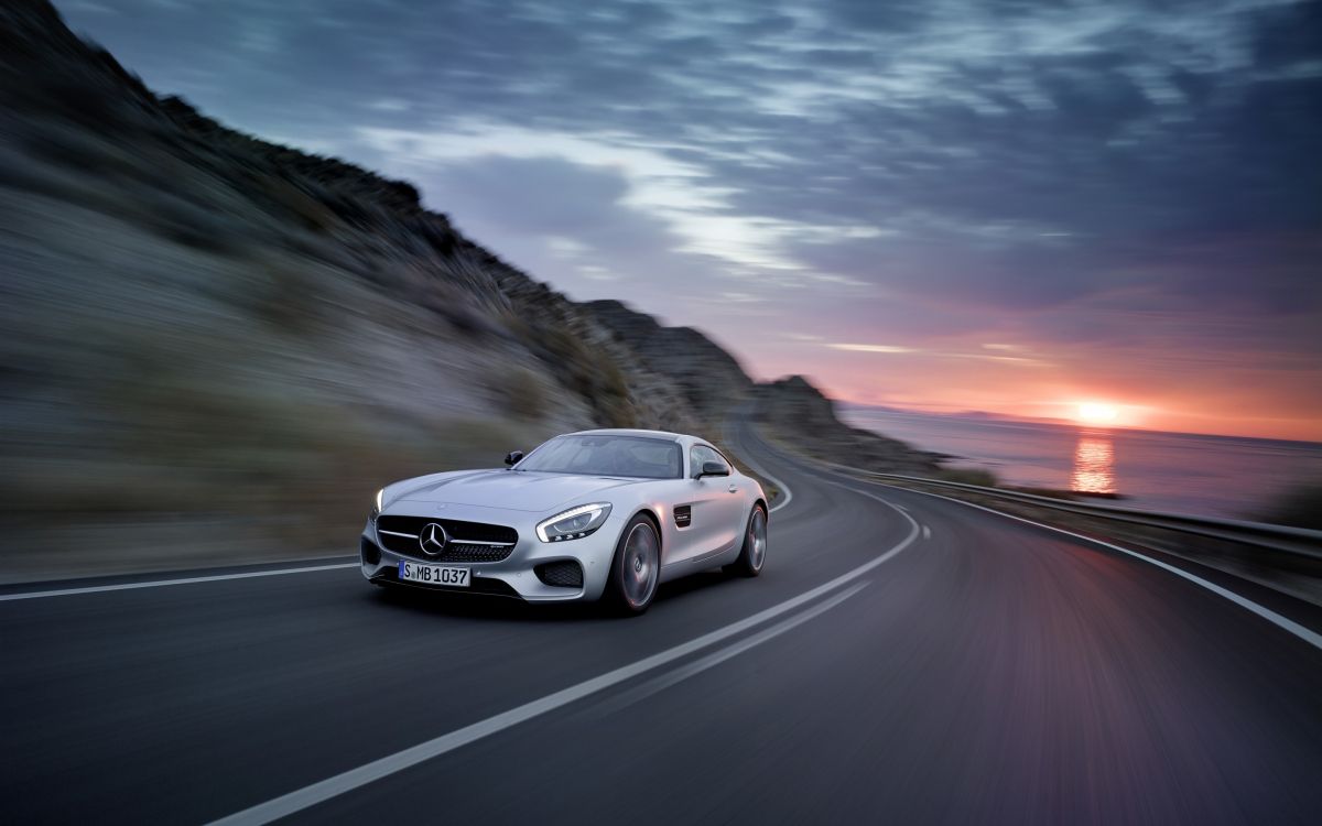 white mercedes benz coupe on road during daytime