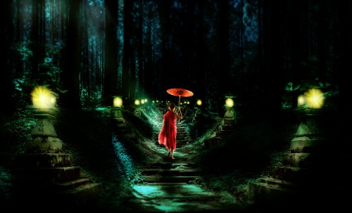 Image woman in red dress holding umbrella walking on pathway