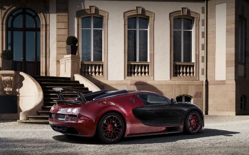 Image red ferrari 458 italia parked in front of brown building