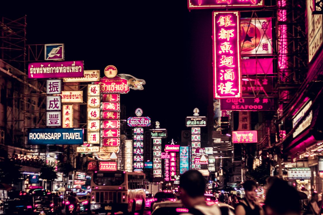 people walking on street during nighttime