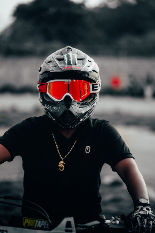 Image person wearing black and red helmet